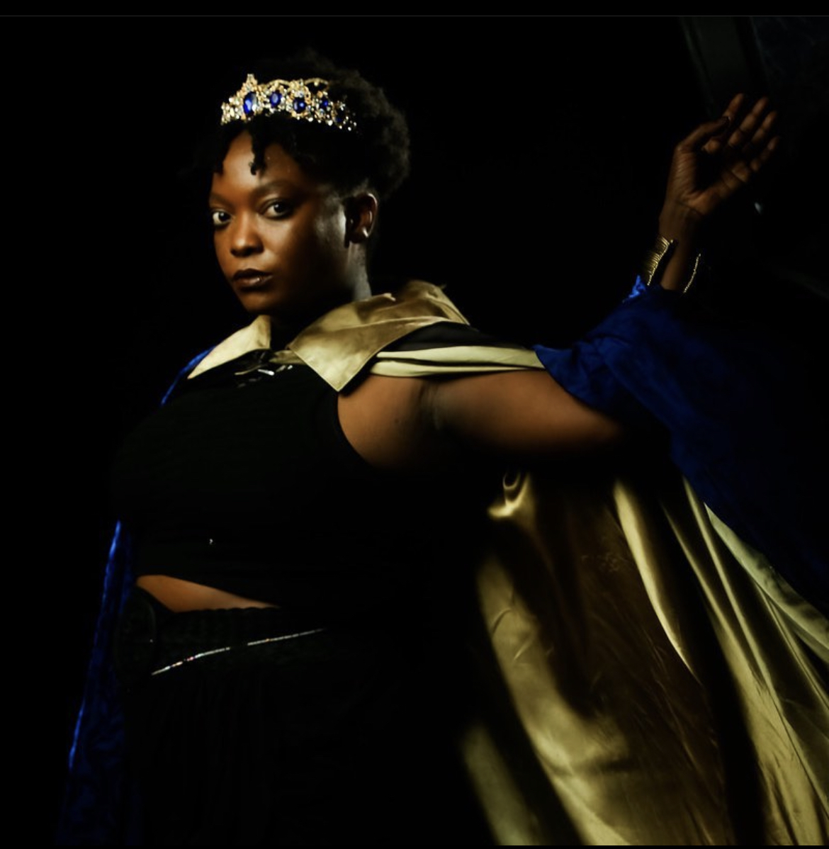 Tenaj Wallace in costume with crown